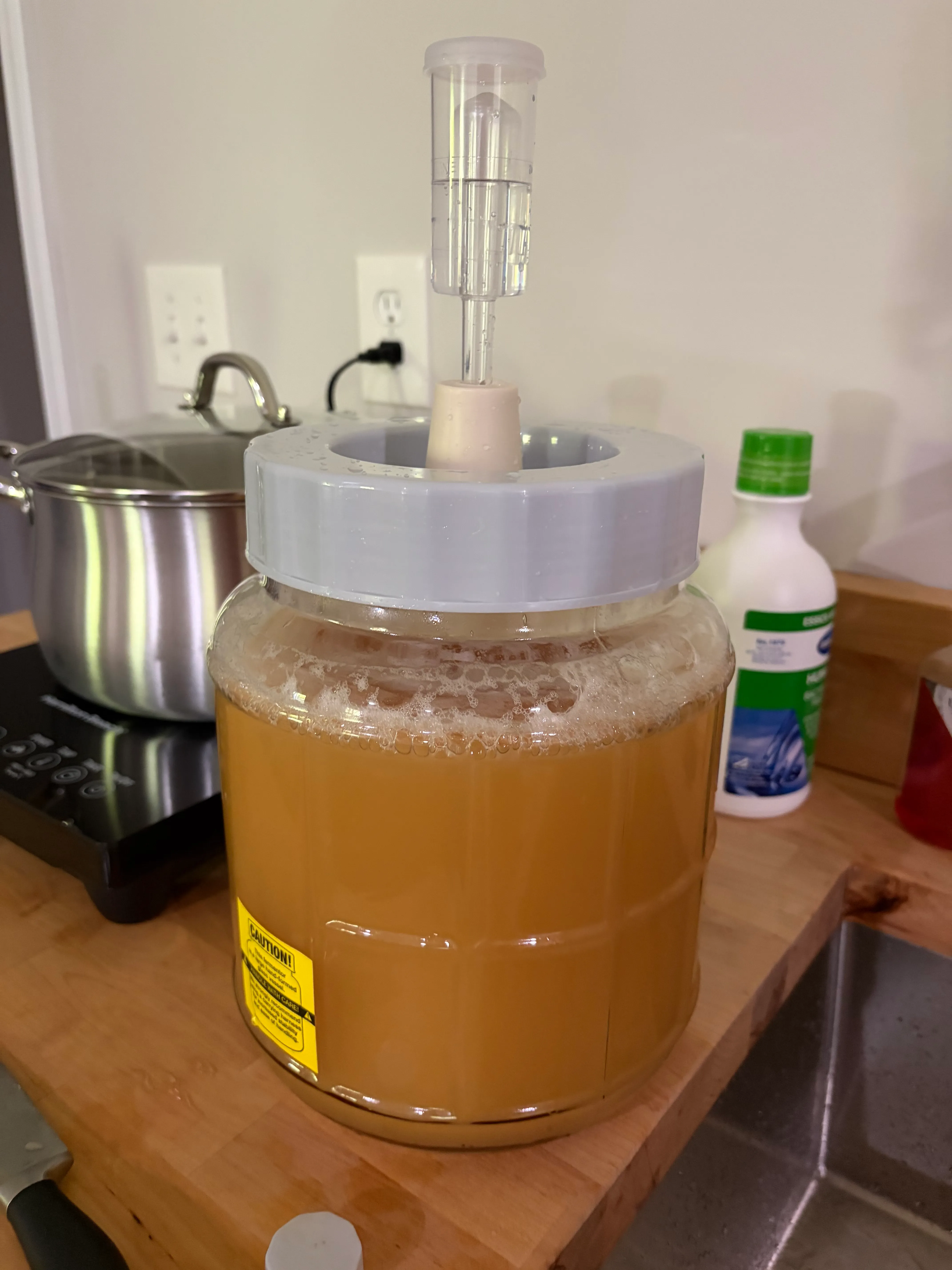Airlock on. From here the yeast work alone.