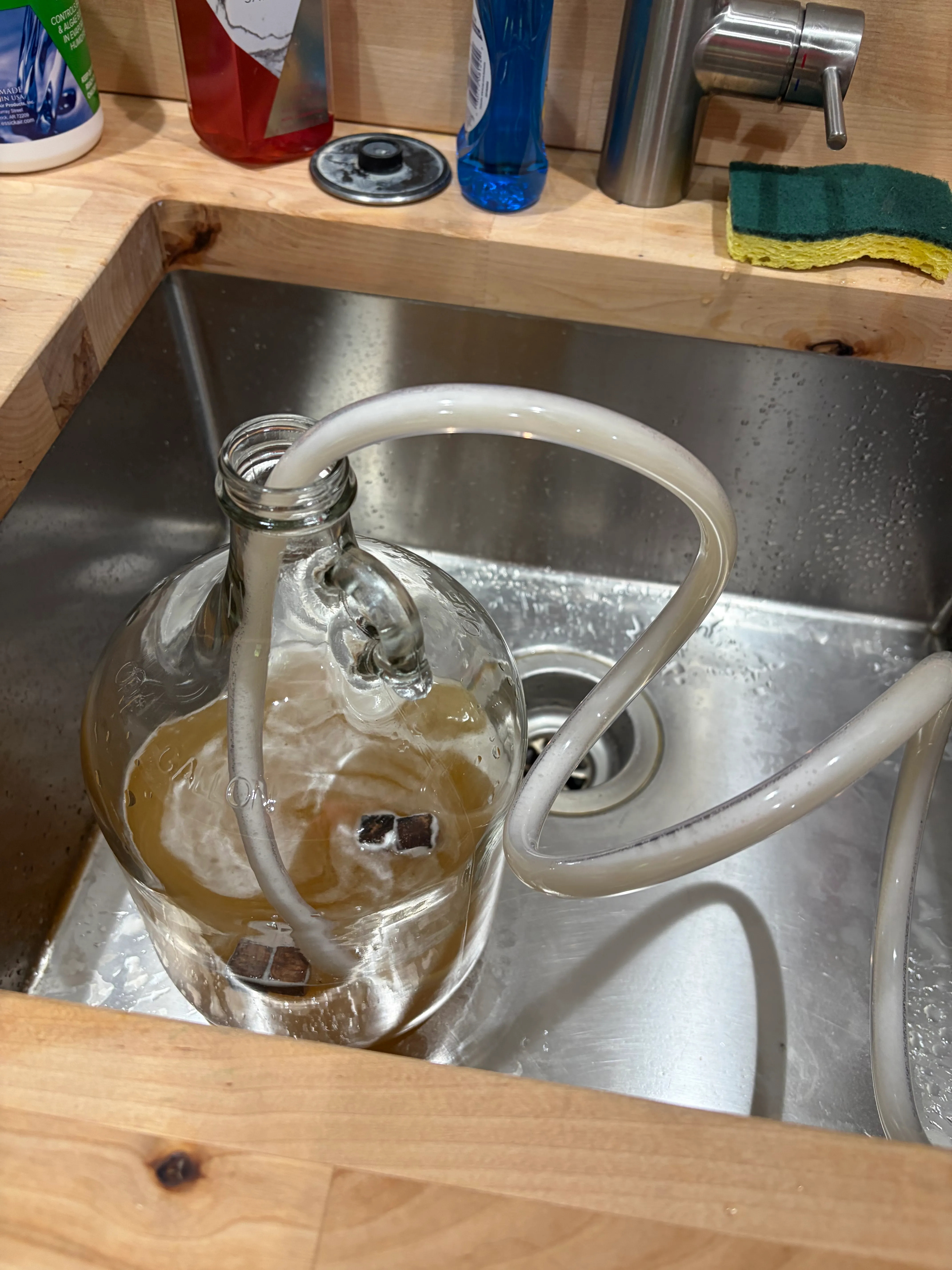 Filling the jug — you can see the fresh oak cubes already waiting in there